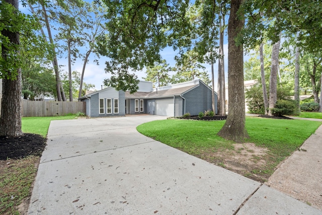 14902 Forest Lodge Dr, Houston, TX 77070 - mid-century modern home with driveway, an attached garage, and brick siding