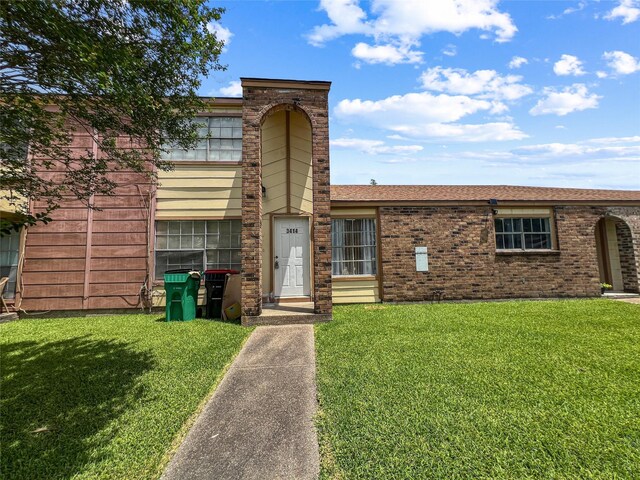 3412 Lantern Ln, Baytown, TX 77521 - view of front of home with a front lawn and brick siding