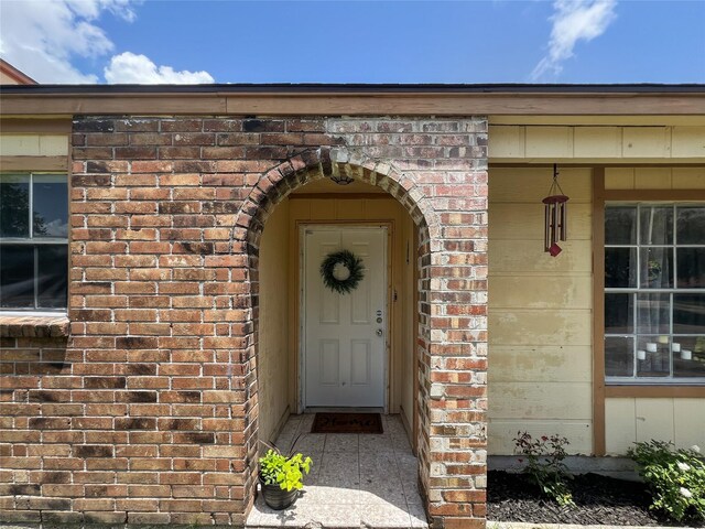 3412 Lantern Ln, Baytown, TX 77521 - doorway to property with brick siding