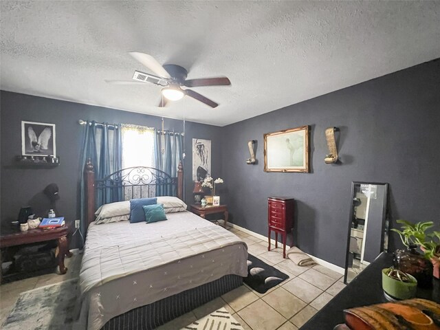 3412 Lantern Ln, Baytown, TX 77521 - bedroom with a textured ceiling, light tile patterned floors, and a ceiling fan