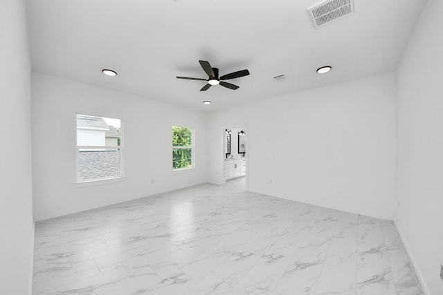 8023 Brandon St, Houston, TX 77051 - spare room featuring ceiling fan, marble look tiles, and recessed lighting