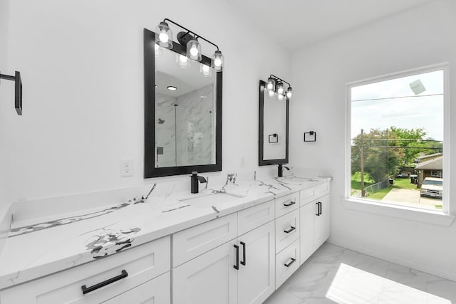 8023 Brandon St, Houston, TX 77051 - bathroom with marble look tiles, a marble finish shower, healthy amount of natural light, and double vanity