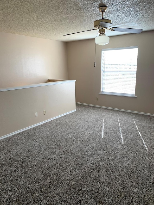 2501 Gulf Fwy Unit 246D, Dickinson, TX 77539 - unfurnished room featuring a ceiling fan, a textured ceiling, and carpet