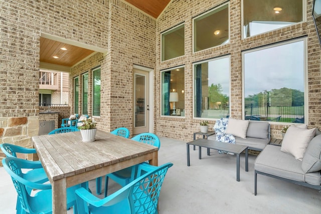 97 La Costa Dr, Montgomery, TX 77356 - view of patio with an outdoor living space and an outdoor kitchen