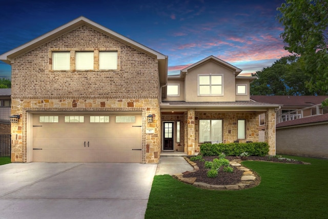 97 La Costa Dr, Montgomery, TX 77356 - view of front facade with stone siding, concrete driveway, a front yard, and stucco siding