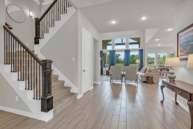 97 La Costa Dr, Montgomery, TX 77356 - foyer with wood finished floors, stairway, and recessed lighting