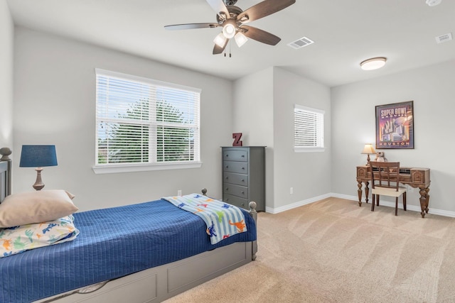 97 La Costa Dr, Montgomery, TX 77356 - bedroom featuring light carpet, multiple windows, and a ceiling fan