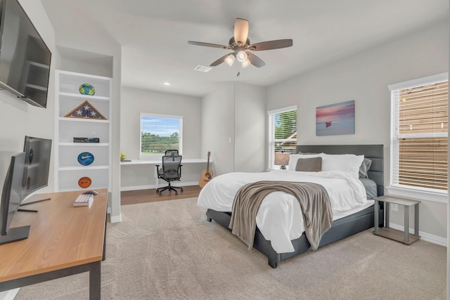 97 La Costa Dr, Montgomery, TX 77356 - bedroom with carpet floors, an office area, multiple windows, and ceiling fan