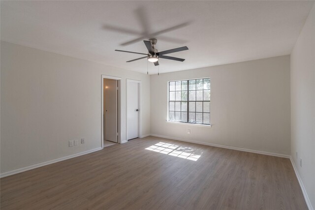 9850 Pagewood Ln Unit 909, Houston, TX 77042 - unfurnished room featuring wood finished floors and a ceiling fan