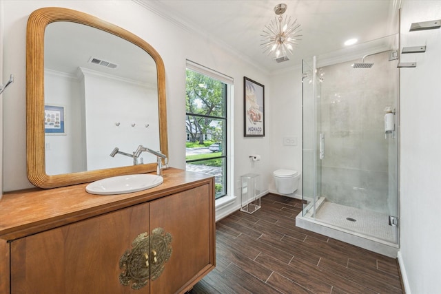 12118 Queensbury Ln, Houston, TX 77024 - full bathroom with vanity, a stall shower, wood finished floors, and ornamental molding