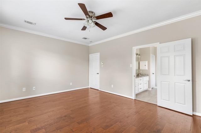 7127 Vermejo Park Ln, Humble, TX 77346 - unfurnished bedroom featuring ornamental molding, light wood finished floors, connected bathroom, and ceiling fan