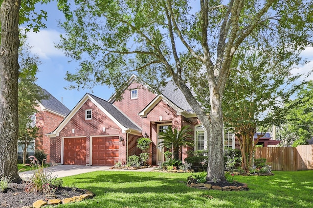 7127 Vermejo Park Ln, Humble, TX 77346 - traditional-style home with brick siding, an attached garage, driveway, and a shingled roof