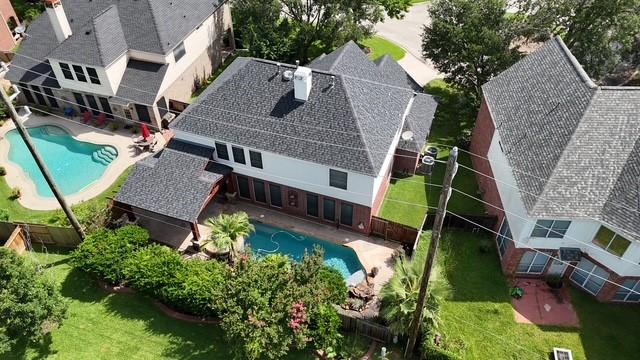 7127 Vermejo Park Ln, Humble, TX 77346 - view from above of property with a pool