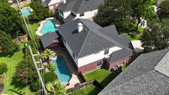 7127 Vermejo Park Ln, Humble, TX 77346 - view of subject property with a pool area