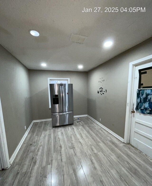 2212 Rugeley St, Bay City, TX 77414 - empty room featuring wood finished floors, recessed lighting, and a textured ceiling