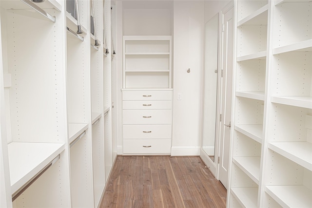 1530 Cunningham Parc Ln, Houston, TX 77055 - walk in closet with light wood-style floors