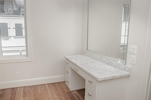 1530 Cunningham Parc Ln, Houston, TX 77055 - bathroom featuring wood finished floors, vanity, and plenty of natural light
