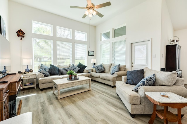 541 Green Meadows Dr, West Columbia, TX 77486 - living area with ceiling fan, light wood-style flooring, and a high ceiling