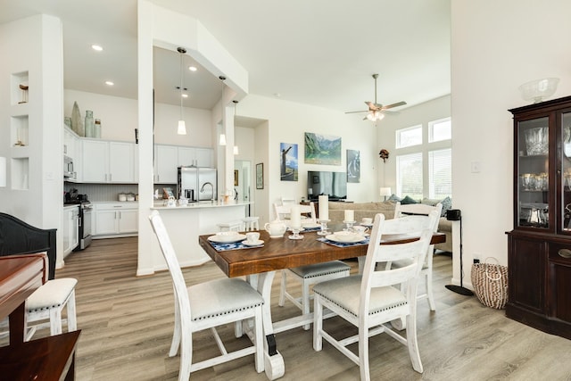 541 Green Meadows Dr, West Columbia, TX 77486 - dining space featuring light wood-type flooring, a ceiling fan, recessed lighting, and a towering ceiling
