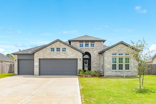 541 Green Meadows Dr, West Columbia, TX 77486 - french provincial home with driveway, an attached garage, and brick siding