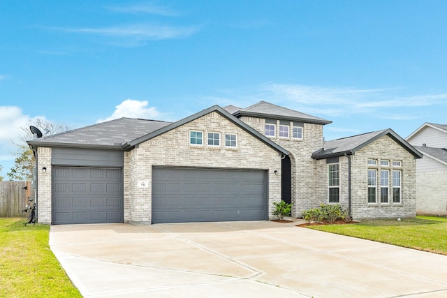 541 Green Meadows Dr, West Columbia, TX 77486 - view of front of property with brick siding, driveway, an attached garage, and roof with shingles