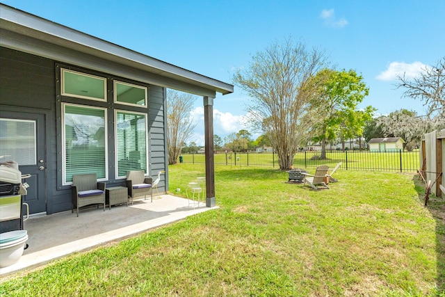 541 Green Meadows Dr, West Columbia, TX 77486 - fenced backyard featuring a fire pit and a patio