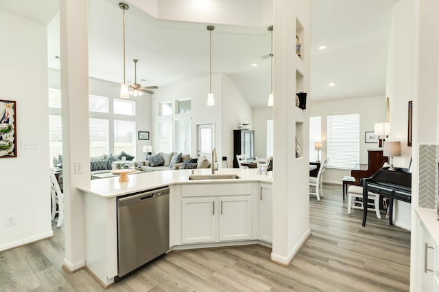 541 Green Meadows Dr, West Columbia, TX 77486 - kitchen with dishwasher, light countertops, open floor plan, light wood finished floors, and ceiling fan