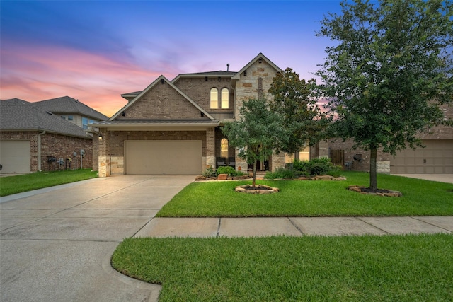 10002 Mahaffey Rd, Tomball, TX 77375 - view of front of property with stone siding, driveway, a front lawn, and a garage
