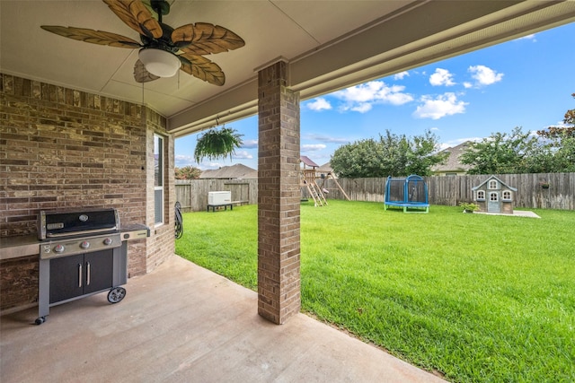 10002 Mahaffey Rd, Tomball, TX 77375 - fenced backyard featuring a trampoline, a playground, a patio, a ceiling fan, and a grill