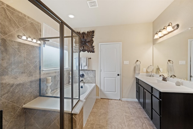 10002 Mahaffey Rd, Tomball, TX 77375 - bathroom featuring double vanity, a bath, a shower stall, and tile patterned flooring