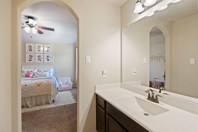 10002 Mahaffey Rd, Tomball, TX 77375 - bathroom featuring a ceiling fan, vanity, and ensuite bathroom