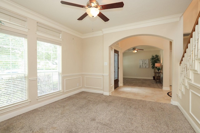 17430 Autumn Oak Way, Spring, TX 77379 - unfurnished room featuring ceiling fan, arched walkways, light carpet, crown molding, and stairs