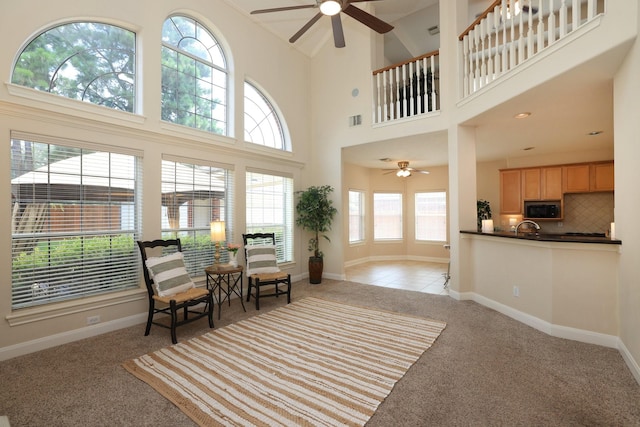 17430 Autumn Oak Way, Spring, TX 77379 - living area with ceiling fan, light colored carpet, and a towering ceiling