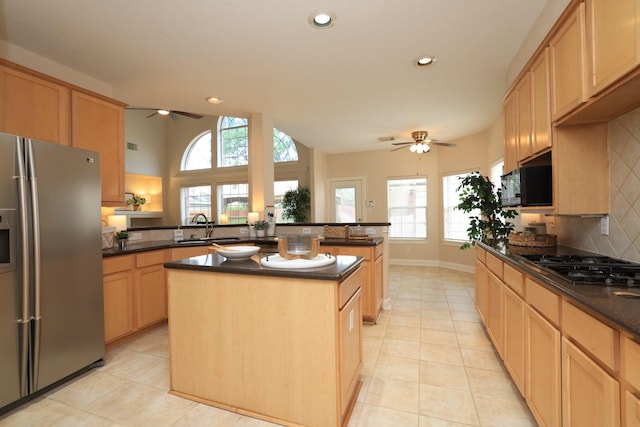 17430 Autumn Oak Way, Spring, TX 77379 - kitchen featuring appliances with stainless steel finishes, ceiling fan, light tile patterned floors, light brown cabinetry, and recessed lighting