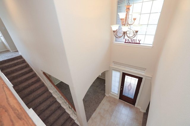 17430 Autumn Oak Way, Spring, TX 77379 - carpeted entryway with a chandelier and stairs