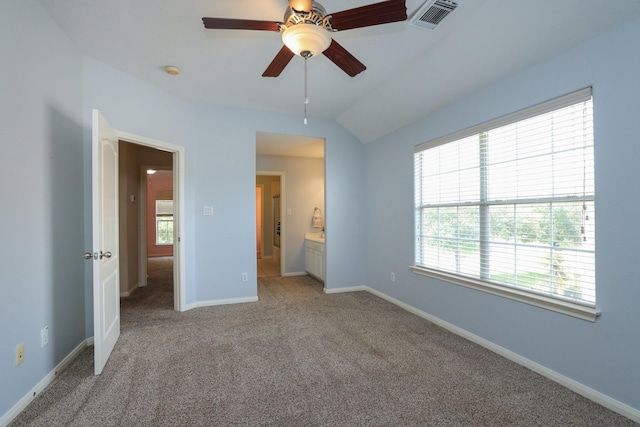 17430 Autumn Oak Way, Spring, TX 77379 - unfurnished bedroom with light carpet, lofted ceiling, connected bathroom, and a ceiling fan