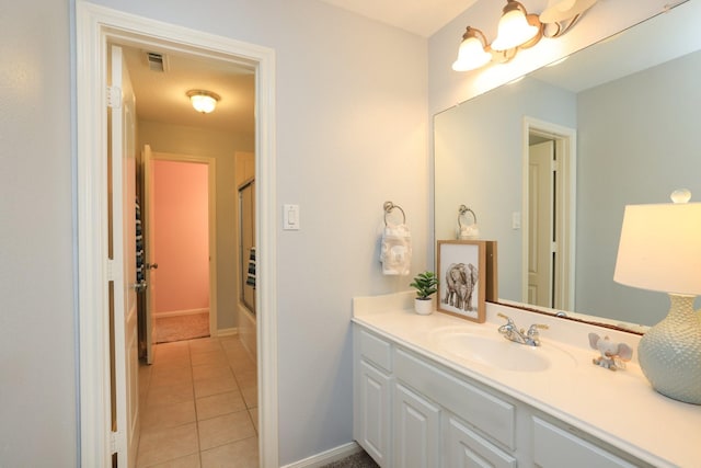 17430 Autumn Oak Way, Spring, TX 77379 - full bathroom with vanity, tile patterned floors, and combined bath / shower with glass door