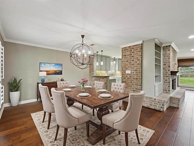 1135 Ivy Ln, Beaumont, TX 77706 - dining space featuring wood finished floors, a chandelier, crown molding, a fireplace, and recessed lighting