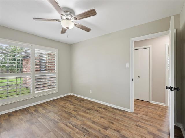 1135 Ivy Ln, Beaumont, TX 77706 - empty room with wood finished floors and ceiling fan