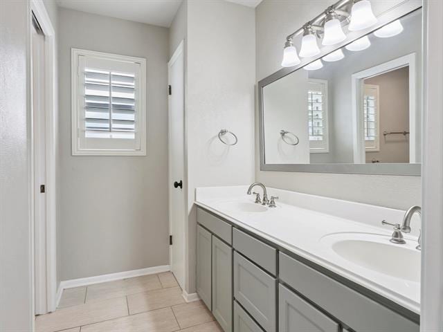1135 Ivy Ln, Beaumont, TX 77706 - full bath with double vanity and tile patterned floors