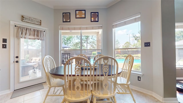 26635 Godfrey Cove Ct, Katy, TX 77494 - dining area featuring light tile patterned floors and ornamental molding