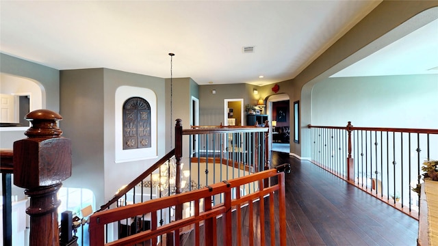 26635 Godfrey Cove Ct, Katy, TX 77494 - hallway with an upstairs landing, hardwood / wood-style floors, and arched walkways