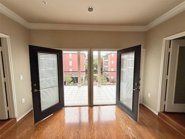 2400 Mccue Rd Unit 345, Houston, TX 77056 - entryway featuring wood finished floors and ornamental molding