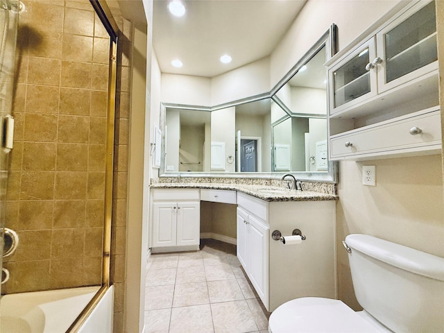 2400 Mccue Rd Unit 345, Houston, TX 77056 - full bathroom featuring double vanity, tile patterned floors, shower / bath combination with glass door, and recessed lighting