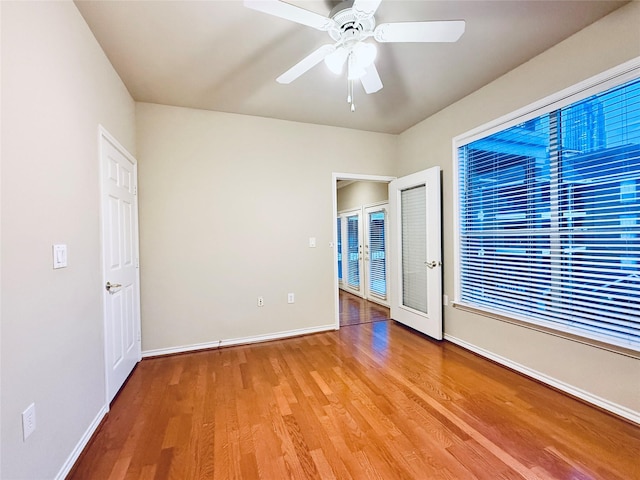 2400 Mccue Rd Unit 345, Houston, TX 77056 - spare room featuring light wood-style floors, ceiling fan, and french doors