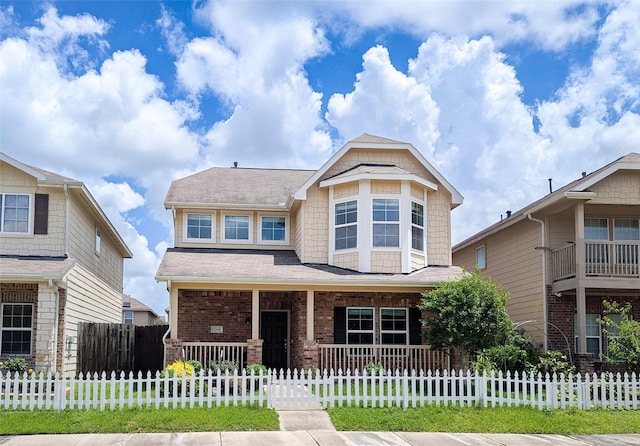 7206 Sunburst Meadow Dr, Houston, TX 77083 - craftsman house featuring covered porch, a fenced front yard, and brick siding