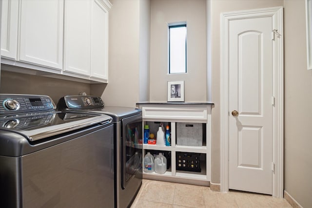 6506 Rodrigo St, Houston, TX 77007 - laundry area featuring cabinet space, washing machine and dryer, and tile patterned floors