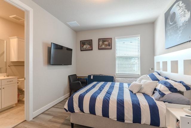 40 Snowdrop Lily Dr, Tomball, TX 77375 - bedroom with light wood-type flooring and ensuite bathroom