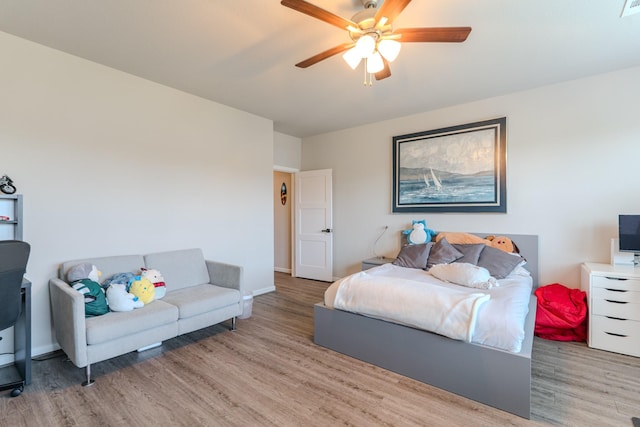40 Snowdrop Lily Dr, Tomball, TX 77375 - bedroom featuring light wood-style flooring and a ceiling fan