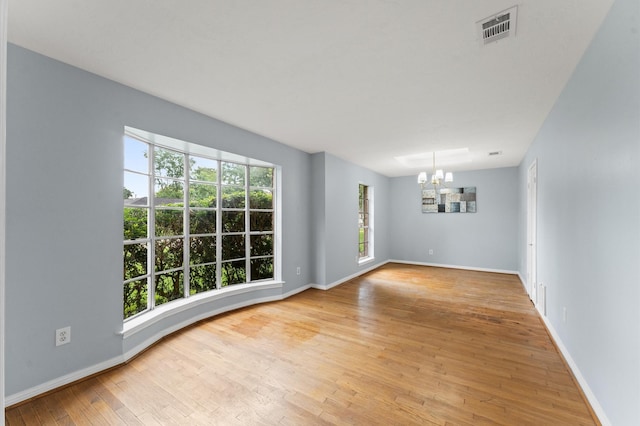 9310 Carvel Ln, Houston, TX 77036 - spare room featuring a chandelier and light wood-style floors